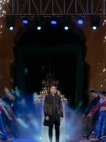 A groom's solo entry needs to have impact. For this performance, I used dramatic backlighting and cold pyrotechnics to highlight him on stage before he was joined by the bride.