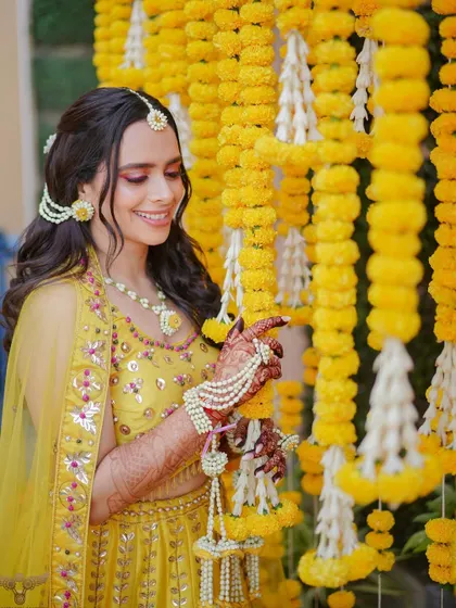 A candid moment during the haldi ceremony. The makeup is holding up perfectly and looks stunning.