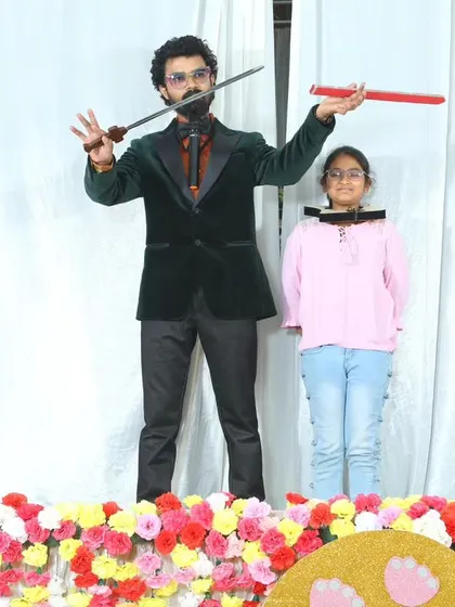 The same thrilling sword trick with a brave young volunteer.