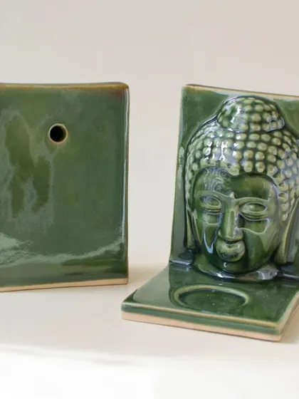 A duplicate view of the versatile Buddha tealight holder, showcasing its front and back. This highlights its dual function as both a tabletop decor piece and a unique wall-hanging candle holder.