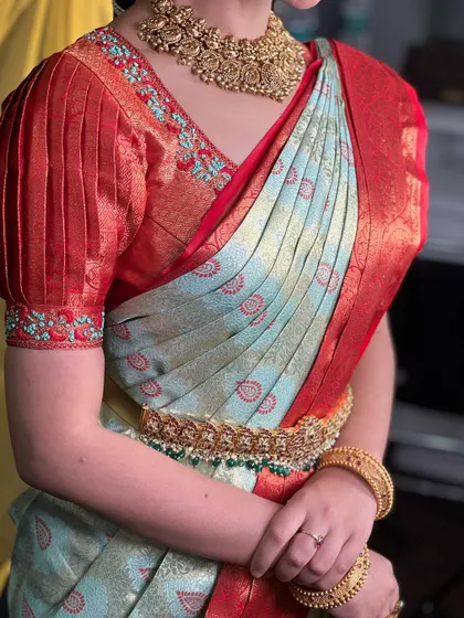 A beautiful example of a classic saree drape, perfect for teaching in my masterclass. The puff-sleeved blouse adds a vintage touch to this elegant look.