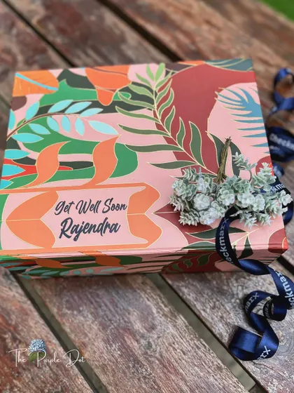 A different style of get well soon gift, this one presented in a vibrant, personalized box.