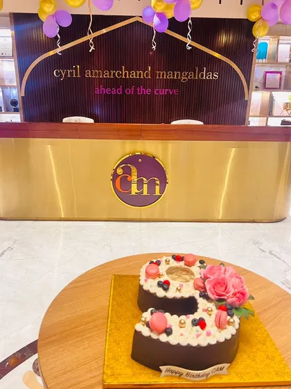 A beautiful cake in the shape of the number 9 at our Delhi NCR office reception, celebrating the 9th anniversary of Cyril Amarchand Mangaldas.