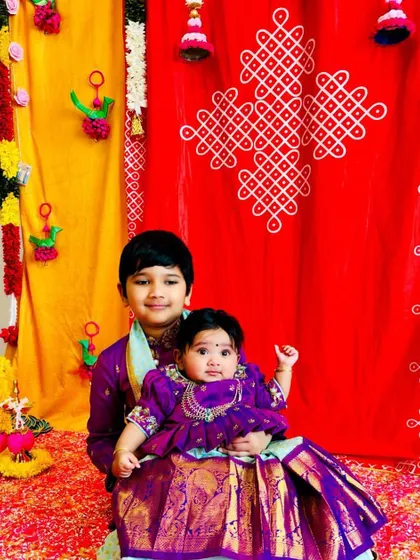 Seeing my creations bring families together is the best feeling. These adorable siblings are twinning in custom purple Kanchi pattu outfits, with the brother in a smart kurta-dhoti and his baby sister in a matching pattu pavadai.