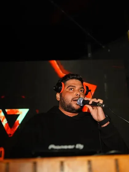 As your MC and hype man, I’m on the mic making sure everyone feels like part of the show. I connect with the crowd, build the hype, and keep the party moving all night long.