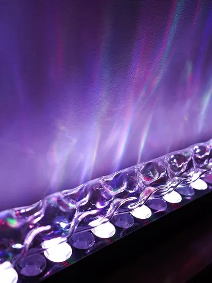 Create a dramatic mood with our Aurora Borealis-inspired wall wash light. This fixture uses a special lens to cast a vibrant, colorful light effect that mimics the northern lights, perfect for creating a unique ambiance in media rooms or lounges.