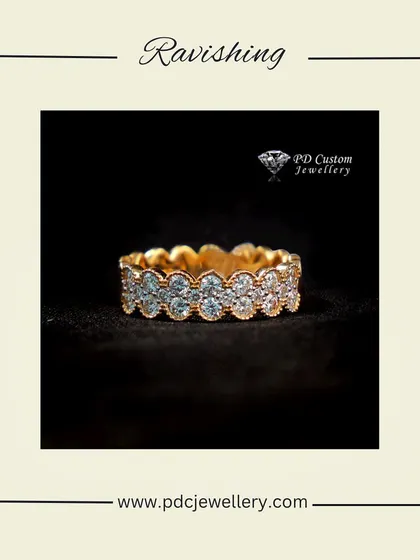 A ravishing full-eternity diamond band in 18kt hallmarked gold. The scalloped setting gives it a vintage-inspired, romantic feel.
