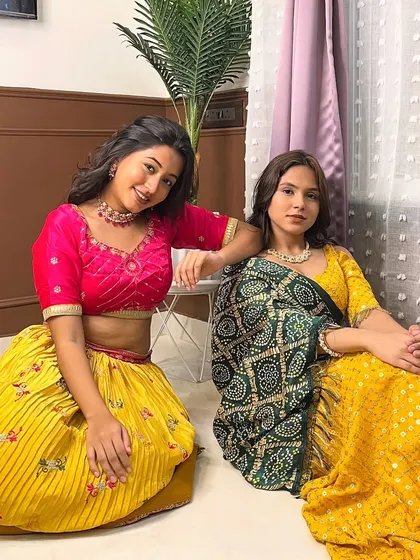 Twinning with friends for Navratri is always a good idea. Both these yellow chanya cholis are available for rent.