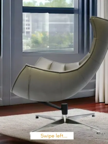 A side view of the imported lounge chair, emphasizing its dramatic, sweeping lines and stable swivel base.