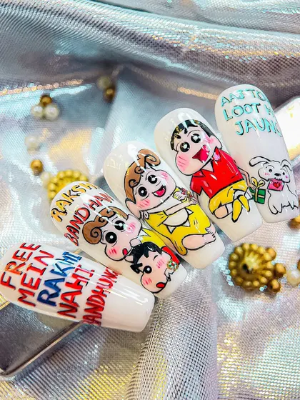 Another angle of the Raksha Bandhan nail art, highlighting the playful interaction between the characters across the different nails.