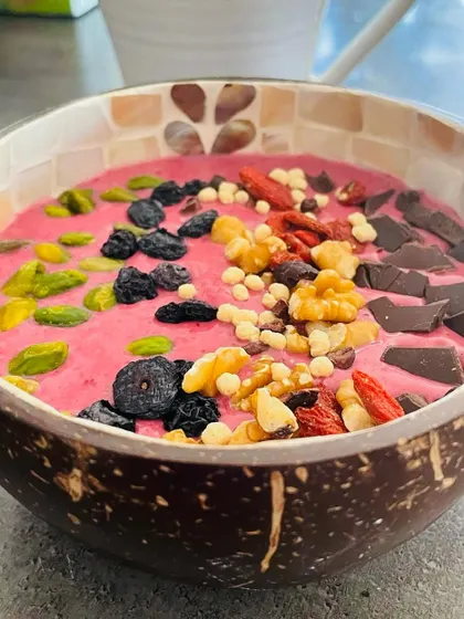 You can't out-train a bad diet. I believe eating well is a sign of self-respect, and I love starting my day with a nutrient-packed smoothie bowl with berries, nuts, and a little dark chocolate.