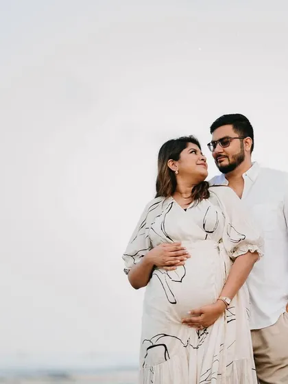 Another lovely shot from a beachside maternity session. Her makeup is kept fresh and minimal, ensuring the focus remains on the happy couple and this special time.