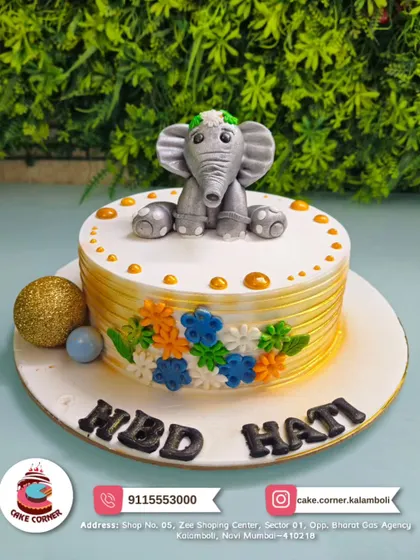 An adorable elephant cake for Hati's birthday. The cute fondant elephant and colourful flowers make this a sweet and charming design.