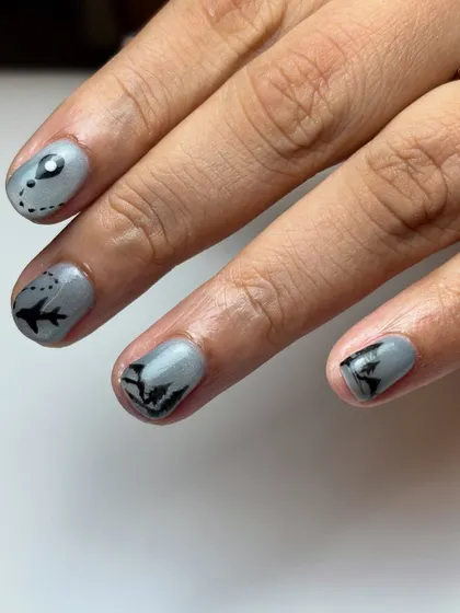 Another angle of the custom travel nails, highlighting the mountain silhouette and the map marker icon. Every nail tells a part of the story.