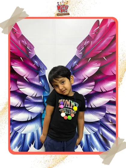 Spreading their wings at our studio. We have this fun angel wings photo wall where kids can pose and be the little angels they are.