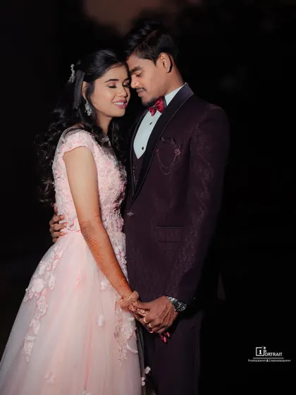 A soft and romantic look for an engagement shoot. The delicate pink hue and floral appliqué on this ball gown create a dreamy and feminine vibe.