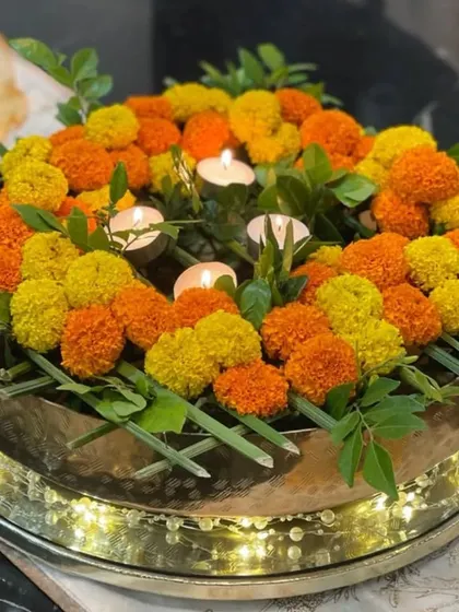 Another angle of the exquisite floral urli. The combination of fresh blossoms and soft lighting is perfect for a special occasion or a simple gathering, elevating the spirit of the space.
