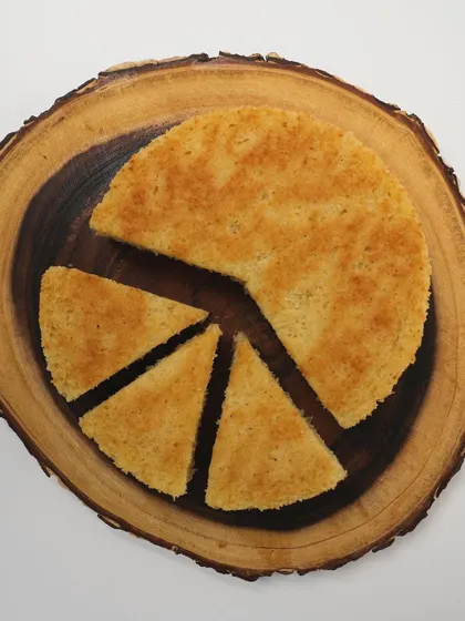 An aerial view of my Vanilla Bean Tea Cake, sliced and ready to be served. Made with real vanilla bean, its flavor is simple, pure, and incredibly comforting.