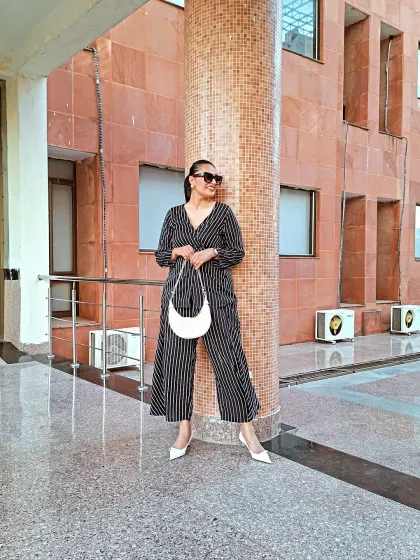 Breaking the mold with this striped co-ord set. The relaxed fit is all about comfort, while the vertical stripes and wrap top create a chic, elongated silhouette. Perfect for women who prioritize comfort without sacrificing style.