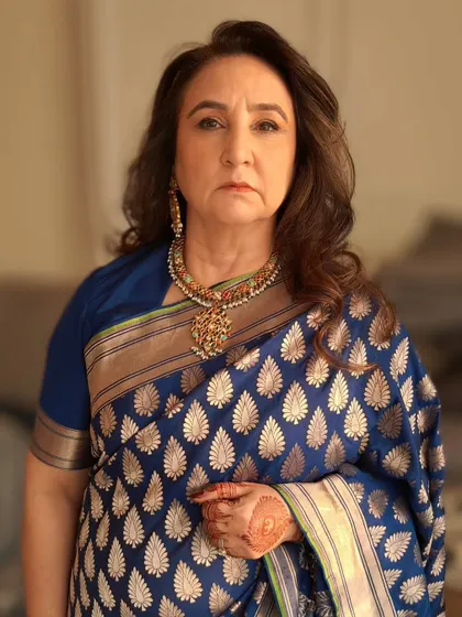 How stunning does she look, all ready for her nephew's wedding? I gave her a voluminous blowout and a classic makeup look that enhanced her natural elegance.