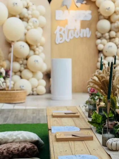 The floor seating arrangement with plush cushions, set against the backdrop of the beautiful boho decor.