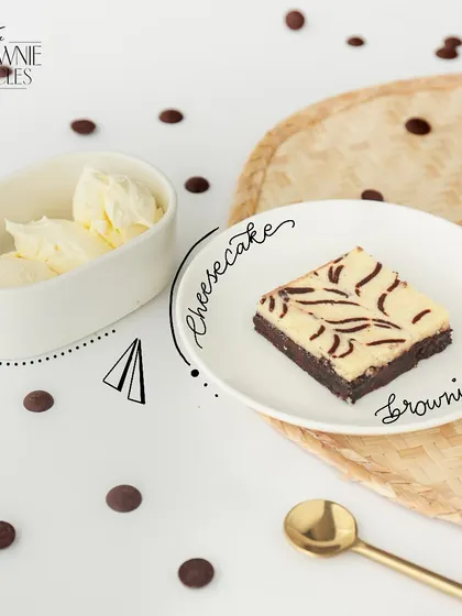 The best of both worlds. Our Cheesecake Brownie features a layer of our classic fudgy brownie topped with a swirl of creamy, tangy cheesecake, baked together to create a truly unique dessert.