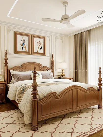 A truly classic master bedroom with a traditional four-poster bed and matching wooden furniture. The wall mouldings and soft color palette create a timeless and regal ambiance.
