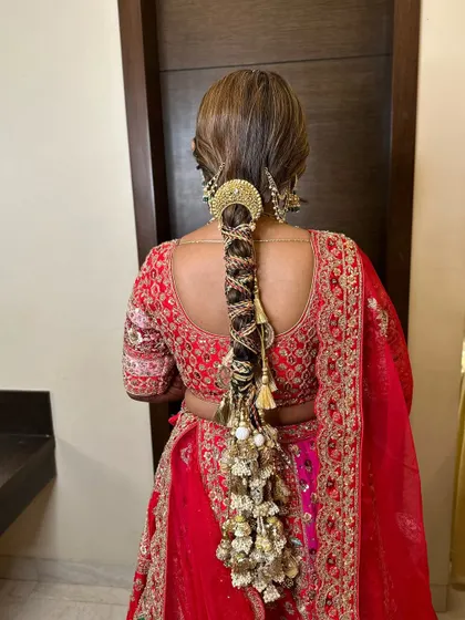 A stunning, heavily accessorized braid for the wedding day. This is a true statement hairstyle, perfect for a bride who wants a look of royal grandeur.