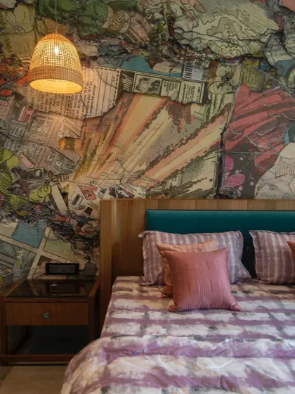 A detailed shot of the vibrant mural behind the bed, showcasing the intricate, layered comic art that gives this bedroom its unique personality.