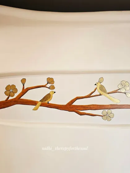 A close-up of two birds perched on a branch. The simple color palette of brown and gold creates a sophisticated and timeless piece of art.