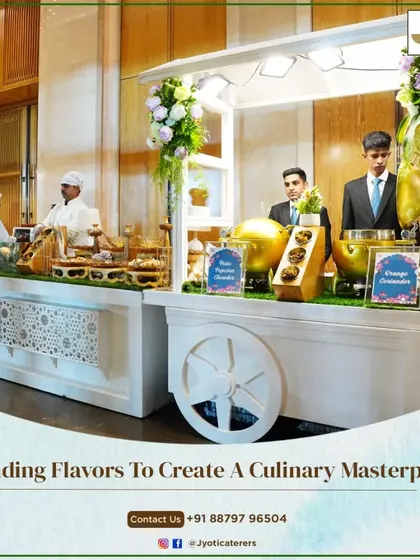 A charming white food cart serves as a unique station, adorned with flowers and ready to offer delicious treats in a beautiful garden setting.