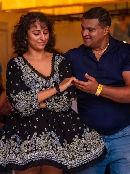 A beautiful, flowing dress and a happy smile. The outfits are as much a part of the fun as the dancing.
