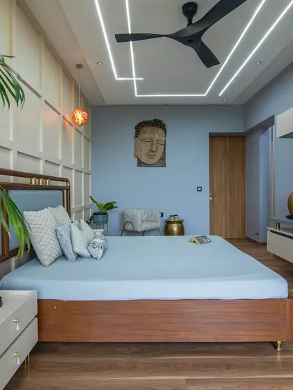 This perspective shows the full layout of the bedroom, highlighting the balance between the sleeping area, the entertainment unit, and the connection to the outdoor balcony.