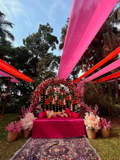 Another angle of the vibrant pink Mehendi decor, showcasing the rich textures and colors that create a festive and joyful atmosphere.