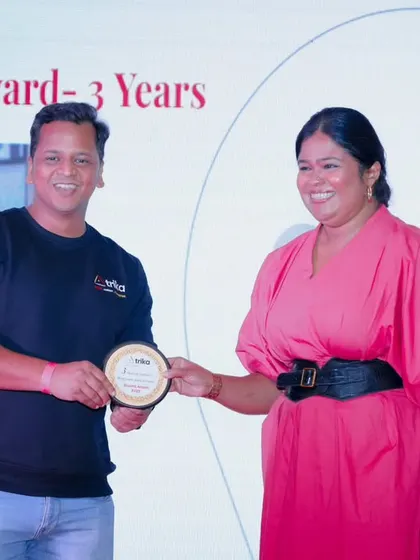 Capturing the moment of recognition at a corporate awards ceremony. These are important milestones for any company and its employees.