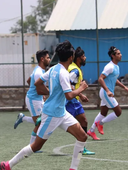 Players running during a fitness drill. Peak physical condition is non-negotiable for high-level performance, and it's a core part of our training.