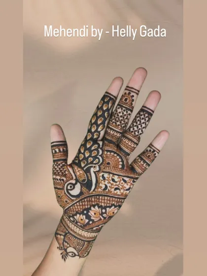 A single-hand view of the detailed peacock design, showcasing the delicate line work and shading that bring the bird to life. This is a classic and elegant choice for any celebration.