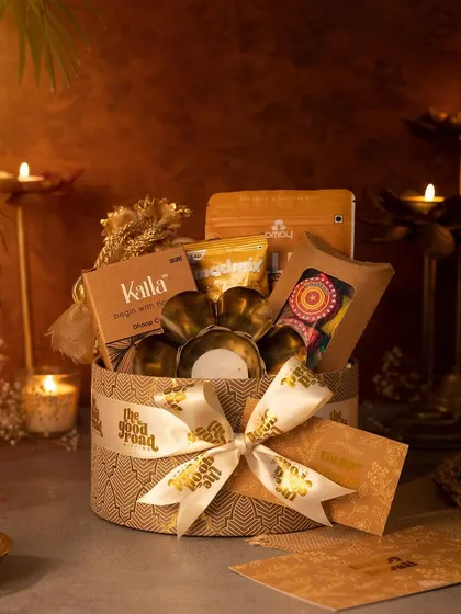 A classic round Diwali hamper, beautifully packed and tied with our custom ribbon. It's filled with festive essentials, making it a perfect gift for employees, clients, or family.