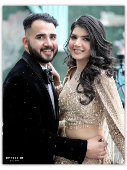 A classic, happy couple portrait. Their bright smiles and comfortable pose make this a timeless shot, perfect for capturing the joy and excitement of their engagement.