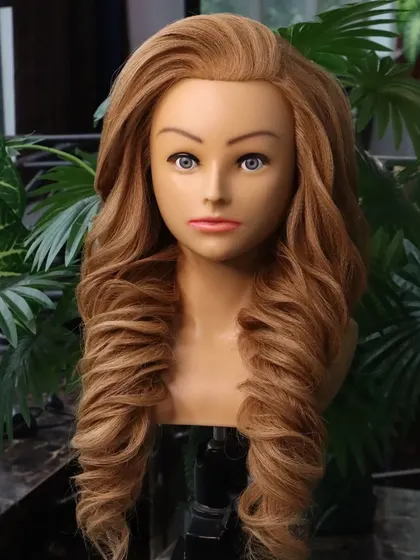 A voluminous wedding hairstyle, perfect for an engagement or reception. The deep, textured curls create a full and glamorous look that is sure to impress.