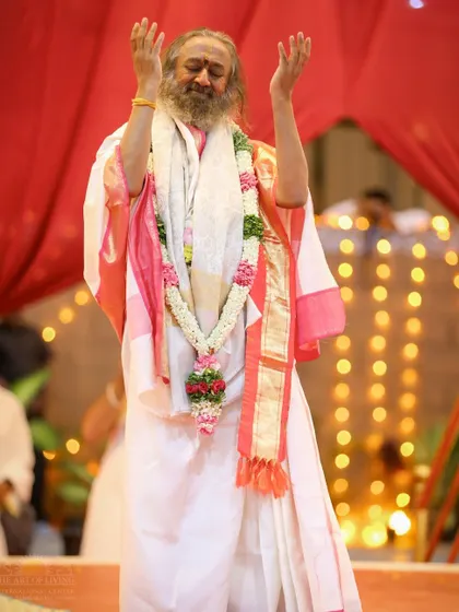 I am standing in joyful celebration during the Maha Sudarshan Homa. The energy during these homas is palpable, lifting everyone into a state of celebration and bliss.