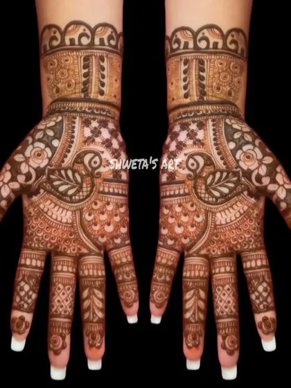 A beautiful and balanced design for the hands. This pattern features peacocks and elephants, making it a great choice for a traditional look at any festival or party.