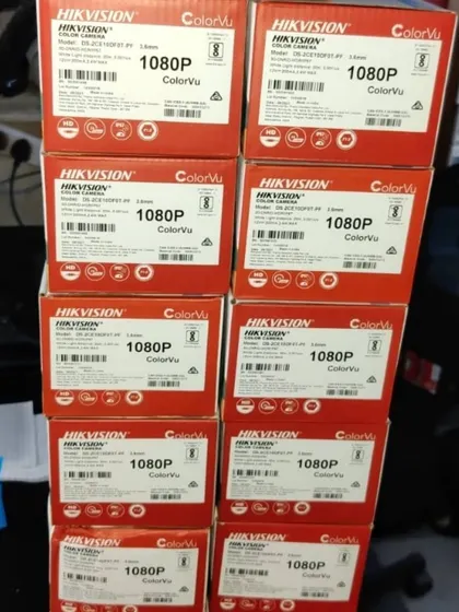 A stack of Hikvision ColorVu 1080p camera boxes, ready for a large installation.
