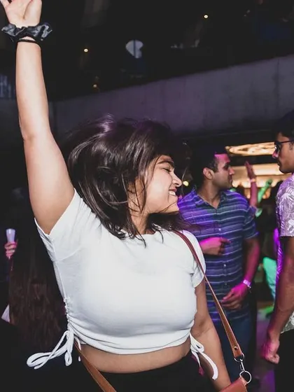 A happy dancer caught in the moment during a Saturday night set. Creating a fun and energetic atmosphere where everyone feels free to dance is what I do best.