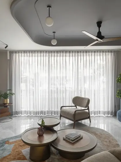 The living room of the Slender House is a formal space on the ground floor. It was designed to create a sustainable internal atmosphere where natural light casts intriguing shadow patterns, and custom art gives a personal touch.