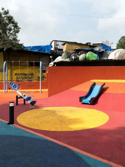 The children's play zone at VDP Garden, equipped with swings and slides. This dedicated area ensures a safe and fun environment for the youngest members of the community.