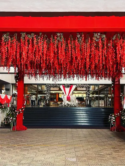 The grand scale of the entrance decor, setting the stage for a massive celebration.