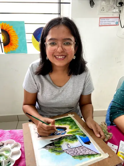 A student in our acrylics course painting a beautiful beach scene. The 8-week program allows you to master techniques like blending and layering.