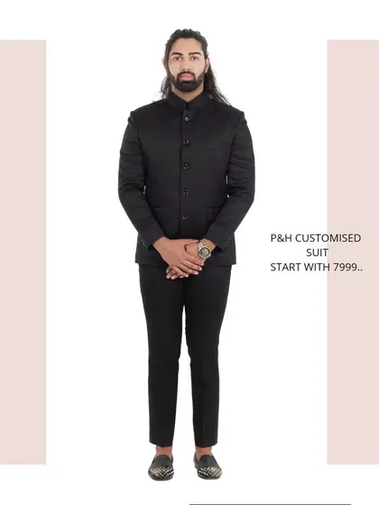 A classic black Jodhpuri or Bandhgala suit, a timeless and essential piece for formal Indian occasions.