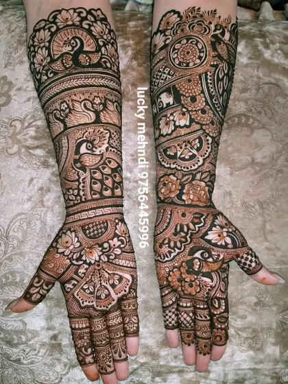 This design is a beautiful example of negative space work. The dark peacocks and floral patterns pop against the lighter skin, creating a 3D effect.